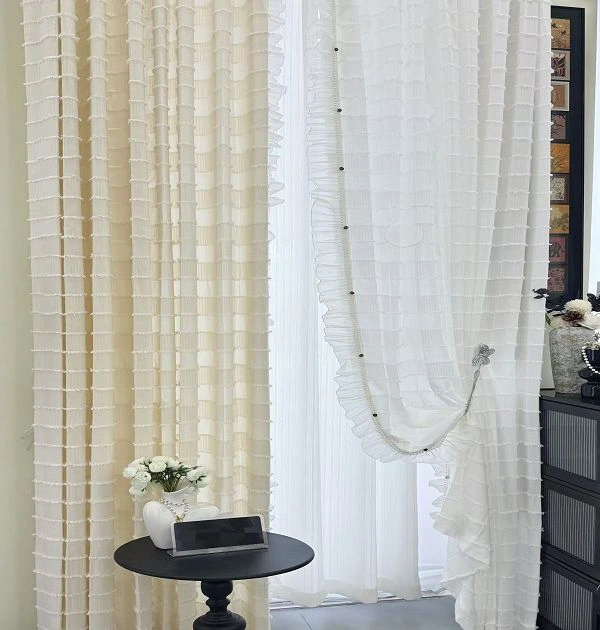 Close up of semi sheer linen look fabric with fringe detail