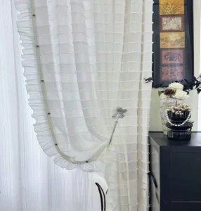 Elegant ivory curtains with beaded trim and ruffle design