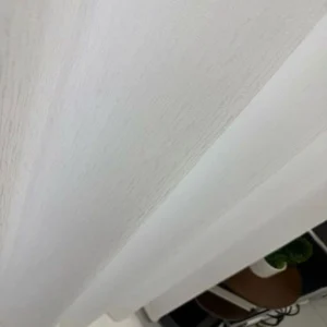 Close-up of white rain texture linen look sheer curtain fabric