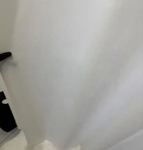 Soft touch jacquard sheer fabric transparency test with hand behind