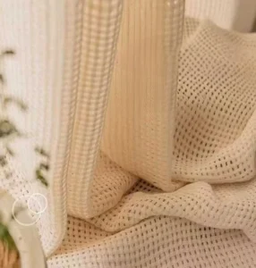 Faux linen mesh sheer fabric providing excellent light filtering, available from reliable curtain supplier.