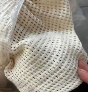 Wholesale open weave sheer curtain fabric with cotton look, supplied by direct manufacturer for B2B projects.
